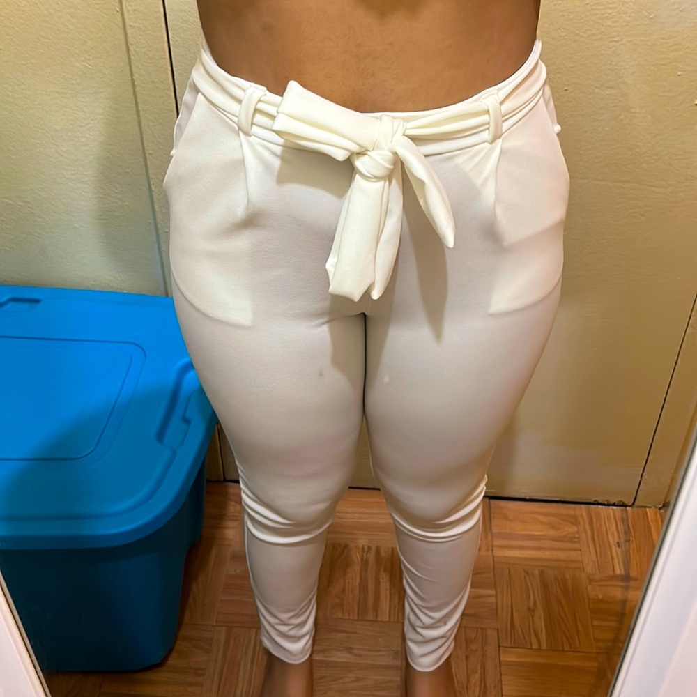 White trousers with belt